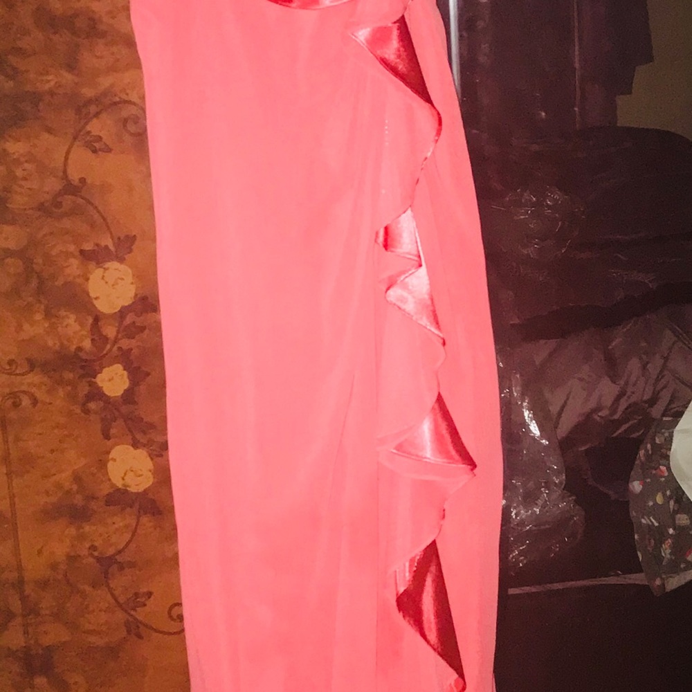 Beautiful salmon colored gown.